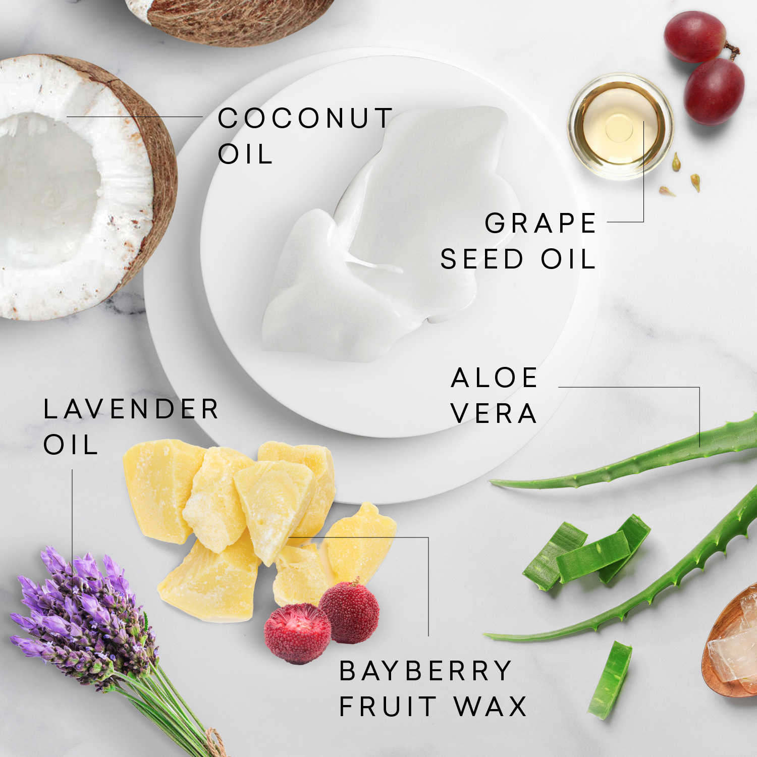 Ingredients including coconut oil, grape seed oil, aloe vera, lavender oil, and bayberry fruit wax on a light background.