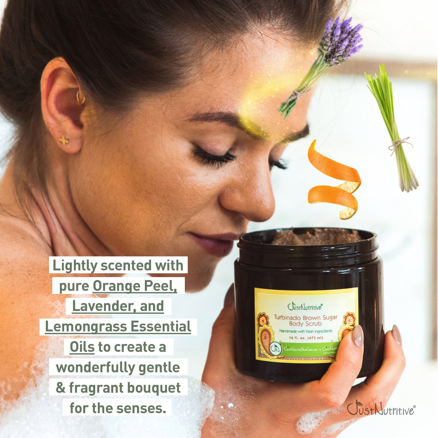 Woman holding a jar of body scrub with lavender and orange peel, featuring essential oil text.