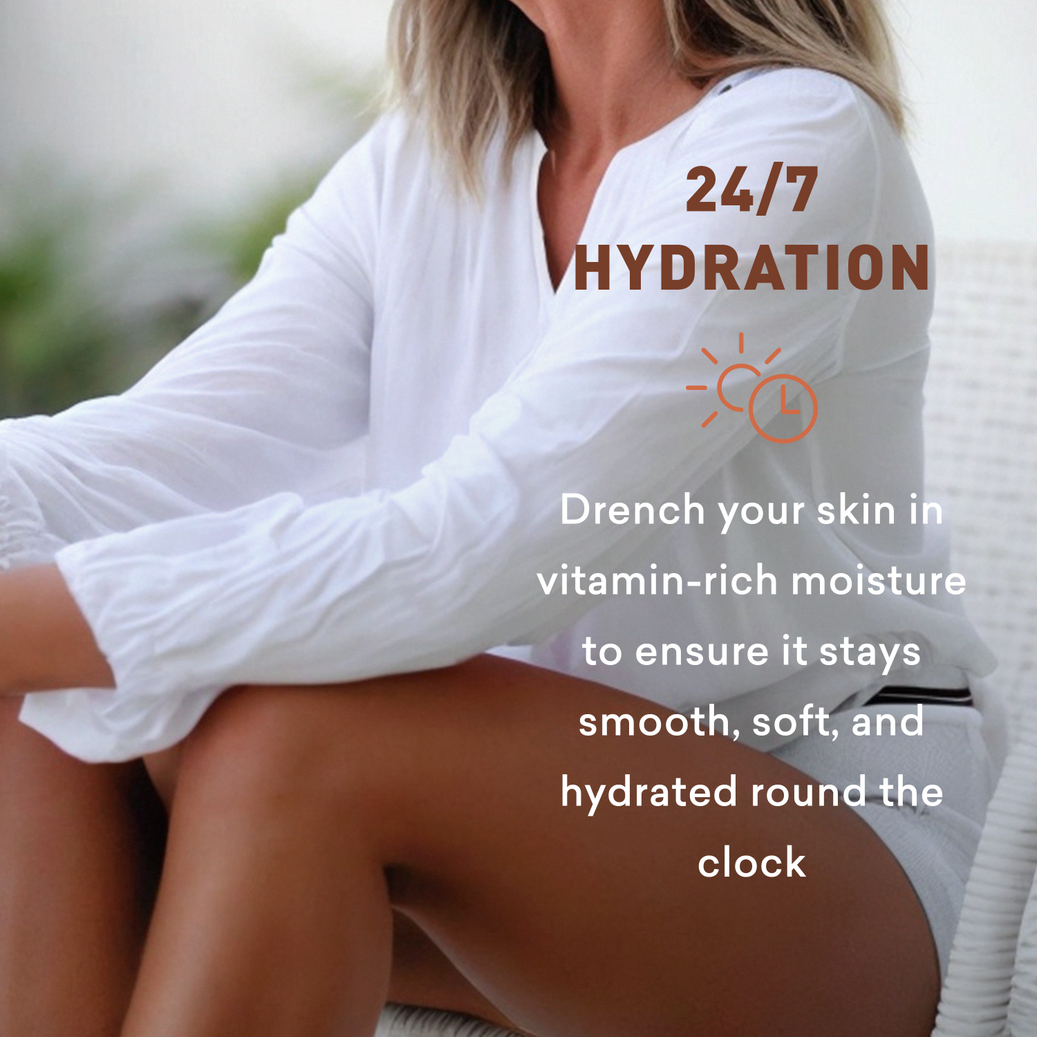 Woman wearing a white shirt with '24/7 Hydration' text, sitting outdoors.