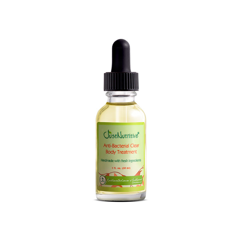 Bottle of Oust Nutritive Anti-Bacterial Clear Body Treatment on a white background
