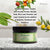 Ointment jar with green label on a countertop, surrounded by Tucuma, Foraha, Karanja Seed, Olive Leaf, Plantain, Allantoin, Panthenol, and Vitamin E.
