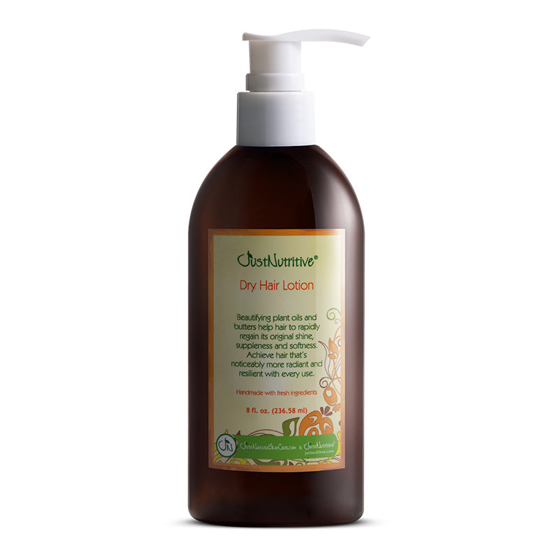 Brown bottle of dry hair lotion with a pump on a white background