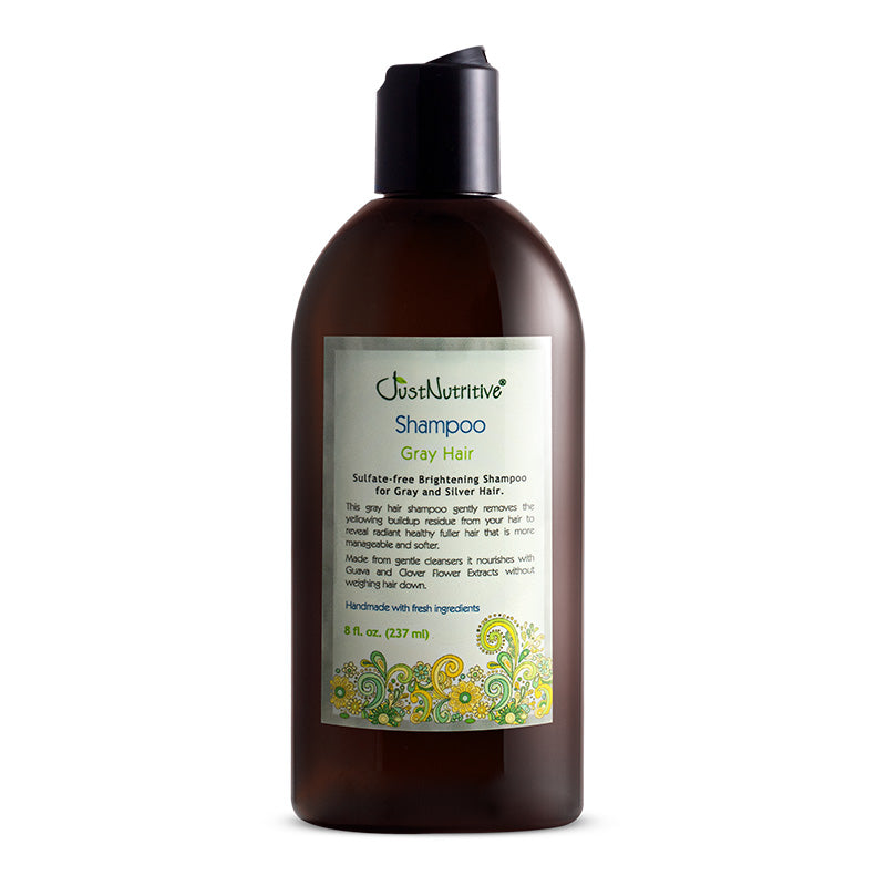 Brown shampoo bottle with a label on a white background
