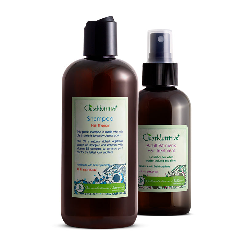 Two brown bottles of Just Nutritive hair care products on a white background