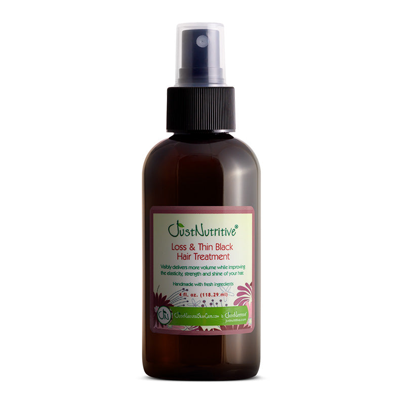 Hair treatment spray bottle with label on a white background