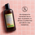 Shampoo bottle with label on a pink tiled background