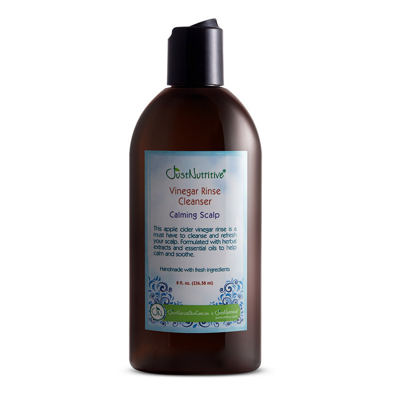 Brown bottle of Vinegar Rinse Cleanser with a label on a white background