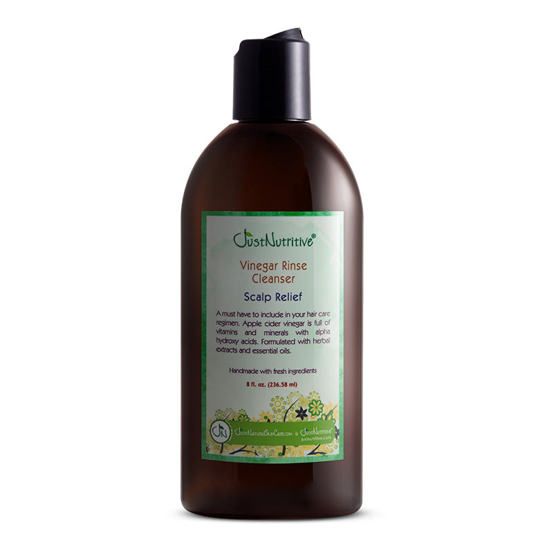 Brown bottle of Just Nutritive Vinegar Rinse Cleanser on a white background