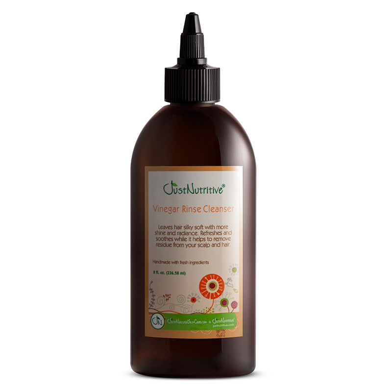 Brown bottle of Just Nutritive Vinegar Rinse Cleanser on a white background